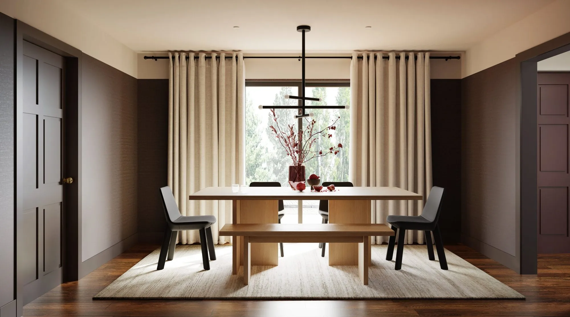 Light oak dining table and bench with black chairs under a black multi-arm chandelier, red branches in a burgundy vase — Grounding roots - Casa de Tarin interior design