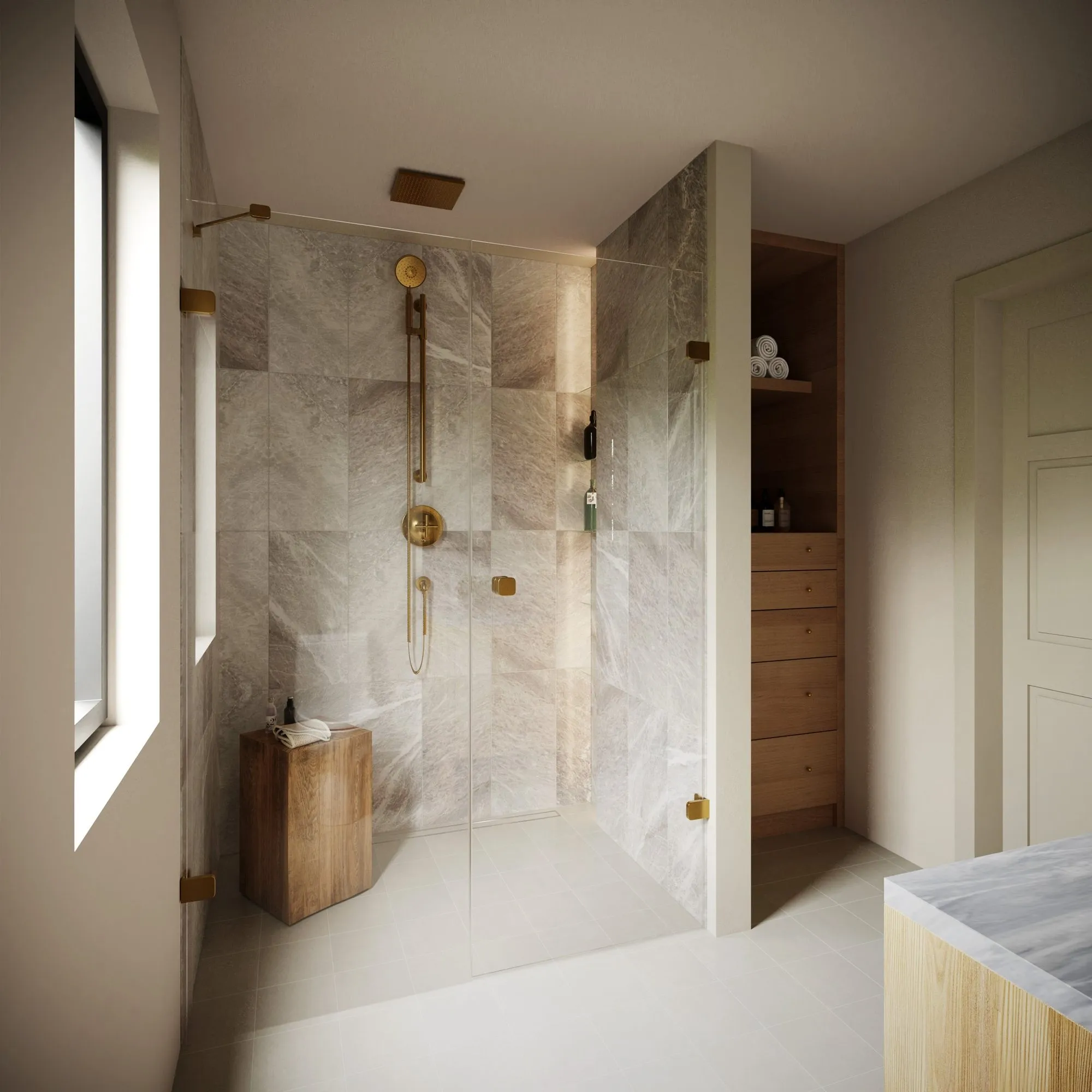 Walk-in shower in marble-look tile with brass rail shower set, glass panels, wood stool and built-in oak dresser beside it — Grounding roots - Casa de Tarin interior design