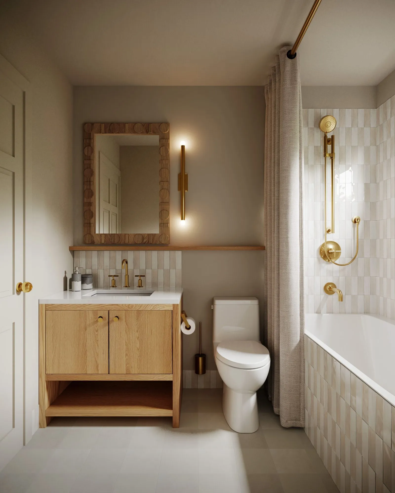 Bathroom with oak vanity, carved wood mirror, brass tube sconce and a tub wrapped in cream stacked tile — Grounding roots - Casa de Tarin interior design