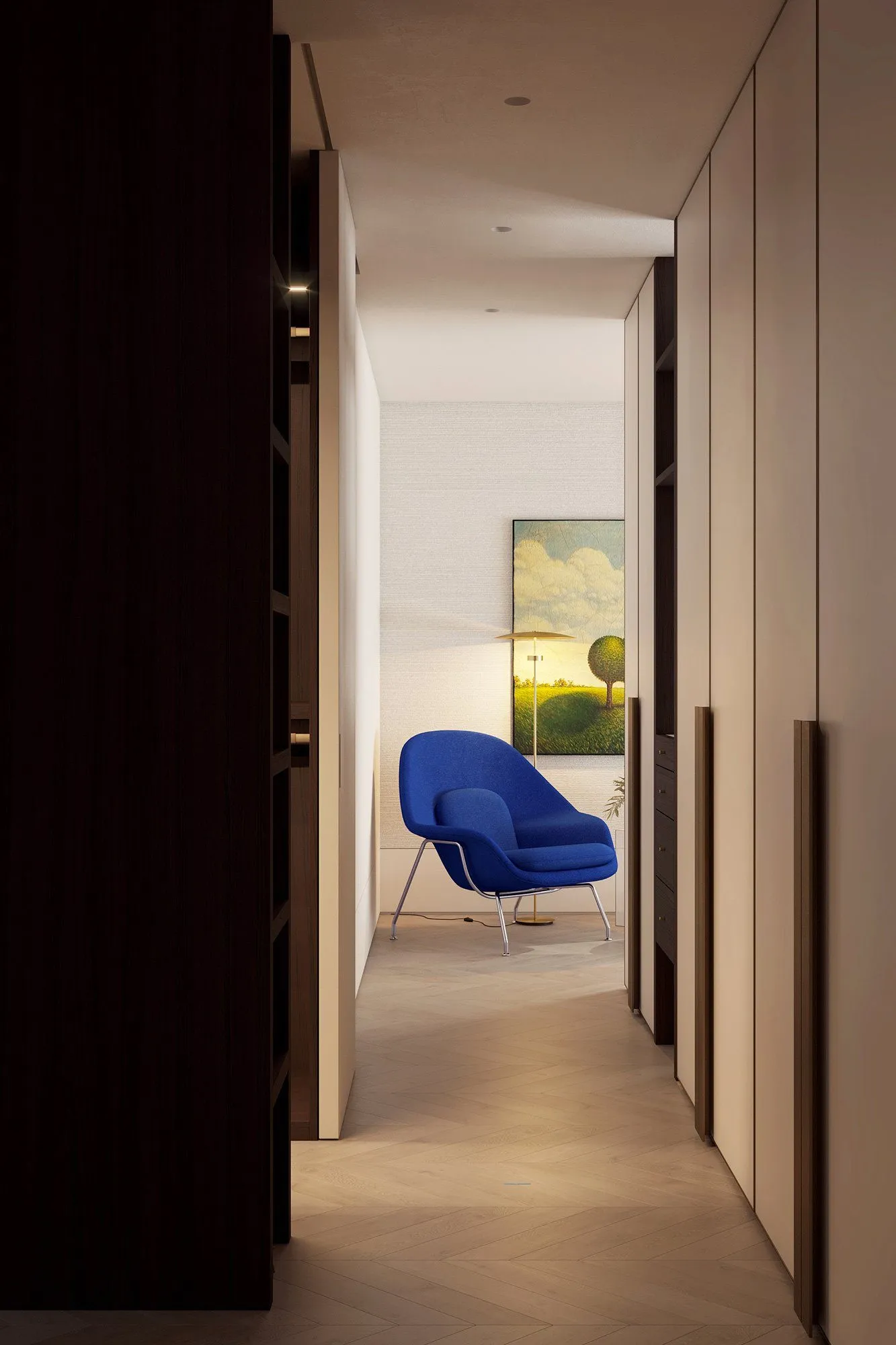 View down a dark wardrobe corridor to a cobalt Womb chair, landscape painting and glowing brass floor lamp — Minimalist Glamour - condo