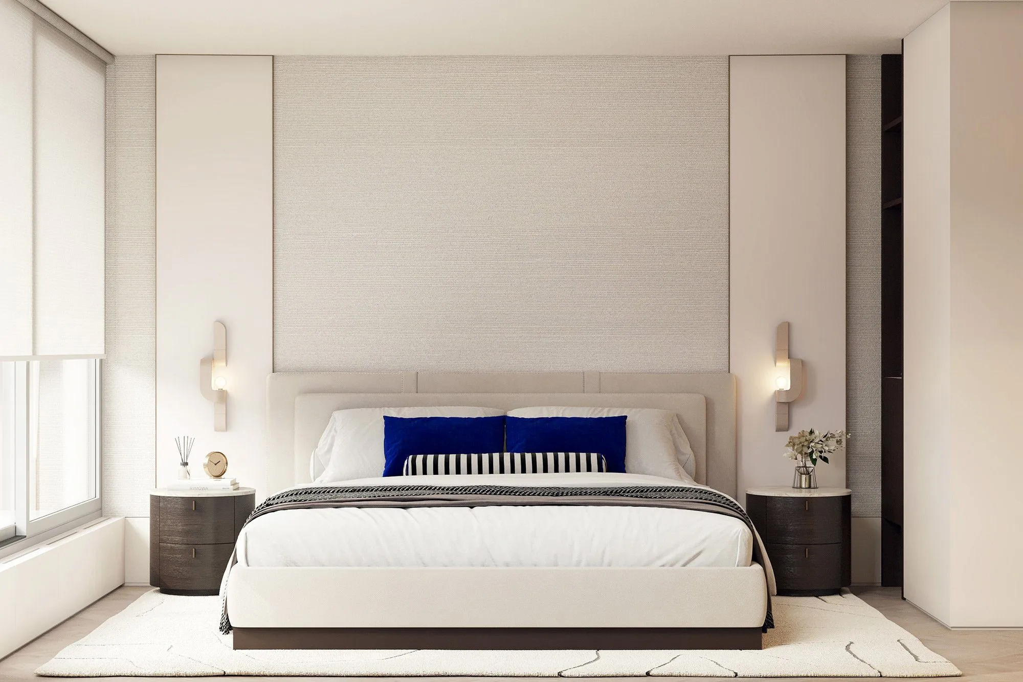 Bedroom with upholstered bed, cobalt velvet pillows and striped bolster, round dark nightstands and sculptural sconces — Minimalist Glamour - condo