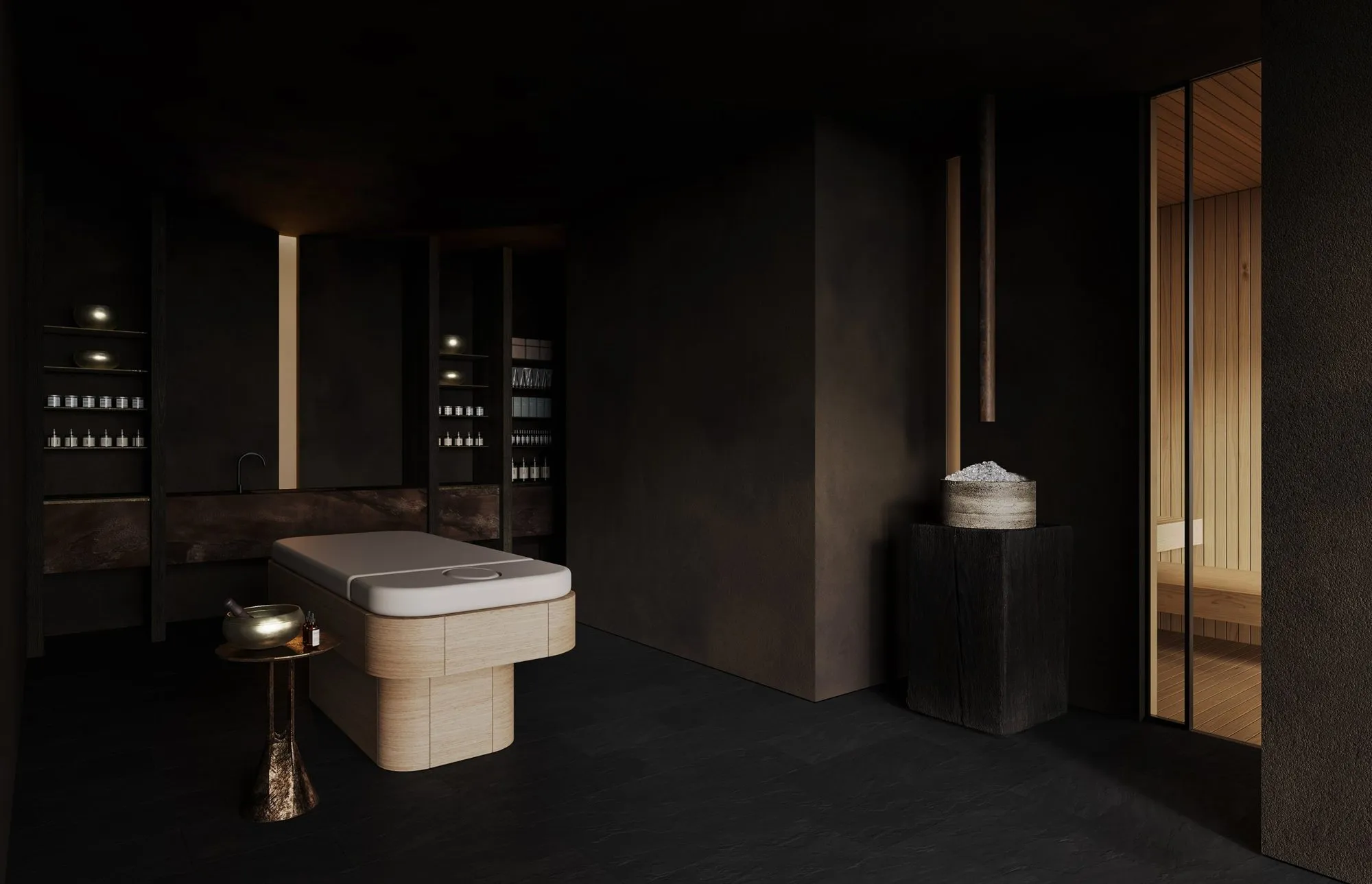Treatment room with a pale wood massage table, hammered-bronze side table and dark shelves of candles and oils beside the sauna door — Obsidian Oasis Spa