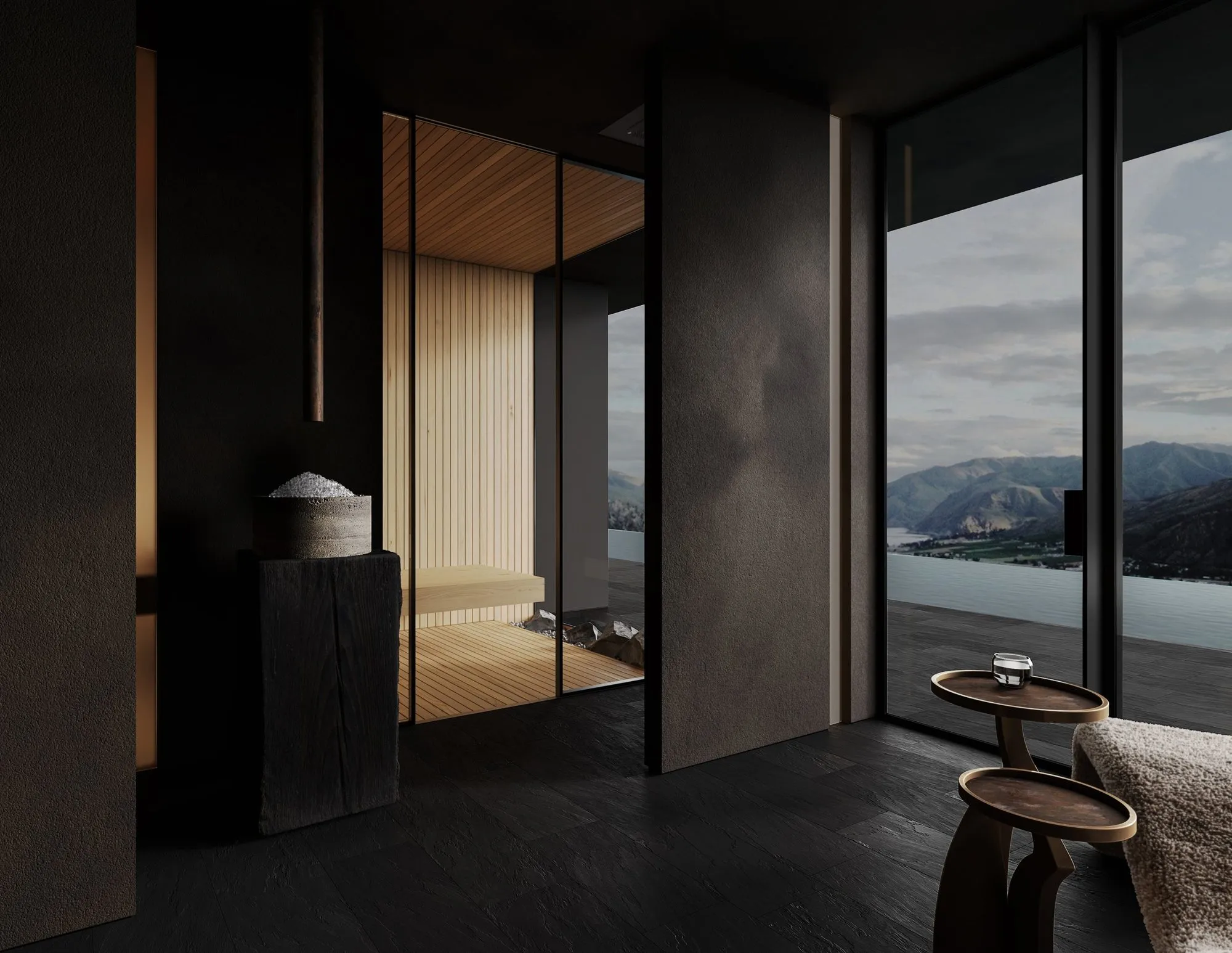 Dark relaxation lounge with slate floors, an ice bowl on a charred-wood pedestal and a glass-walled cedar sauna beside floor-to-ceiling mountain views — Obsidian Oasis Spa